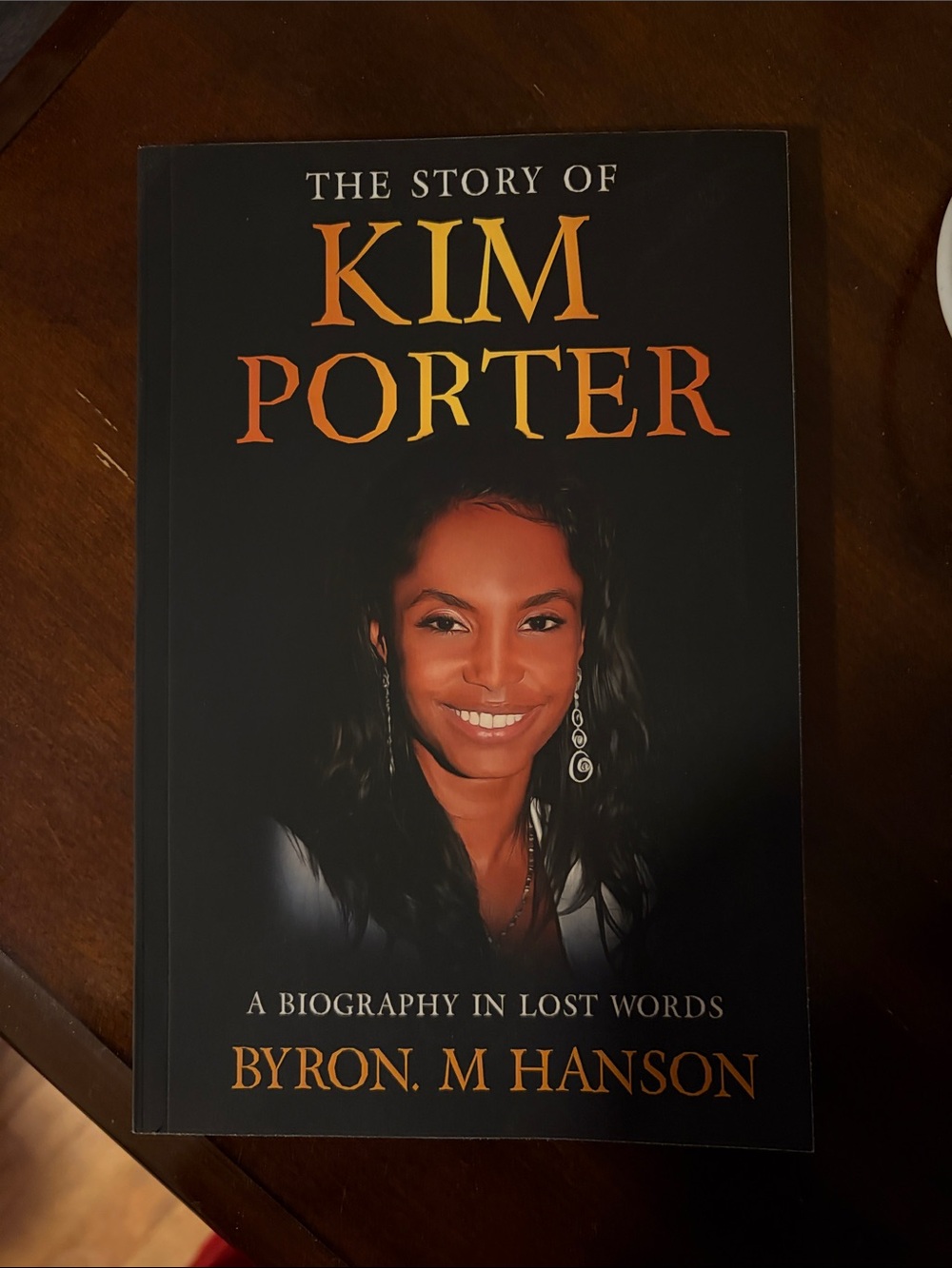 The Story of Kim Porter byron m hanson - Black Cover with Orange Title